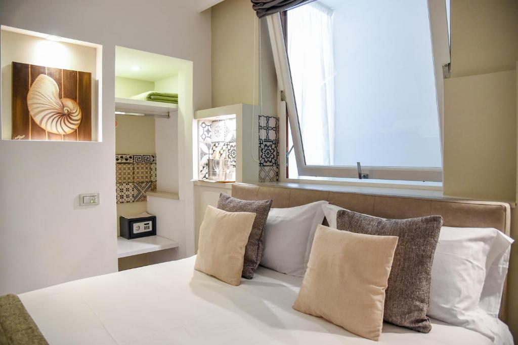 Postel nebo postele na pokoji v ubytování Hotel Sorrento City