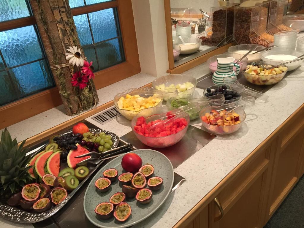 a kitchen counter with a bunch of fruits and vegetables at Hotel Styrolerhof in Steeg