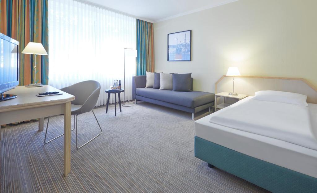 Postel nebo postele na pokoji v ubytování Upstalsboom Parkhotel