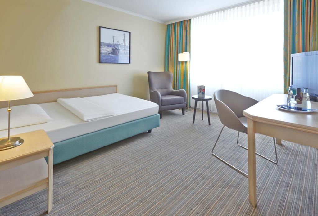 Postel nebo postele na pokoji v ubytování Upstalsboom Parkhotel