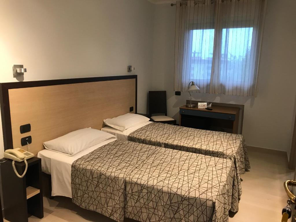 Postel nebo postele na pokoji v ubytování Hotel Citta' Di Conegliano