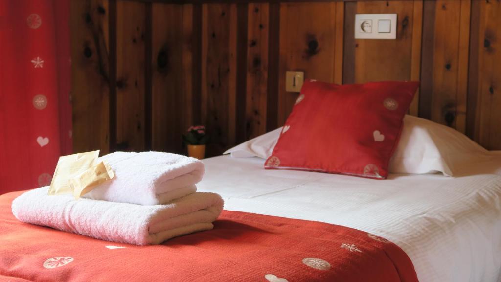 מיטה או מיטות בחדר ב-Le Dahu