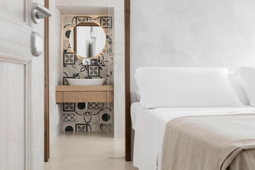 Postel nebo postele na pokoji v ubytování Palazzo Sant'Anna Lecce