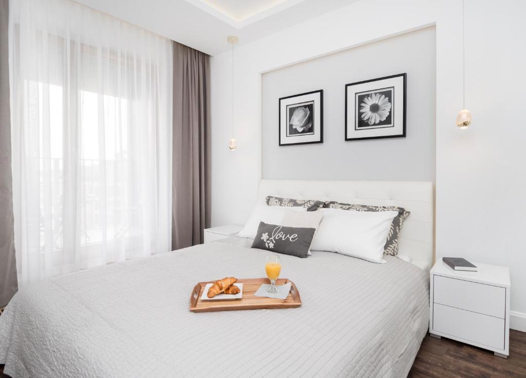 Posteľ alebo postele v izbe v ubytovaní Landmark Apartments