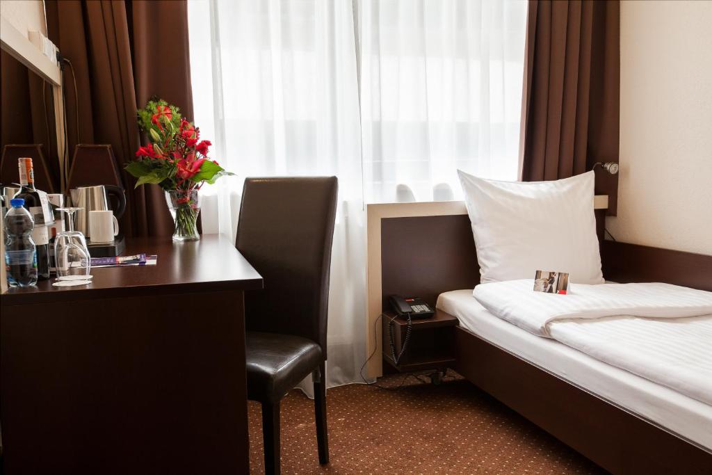 Postel nebo postele na pokoji v ubytování Hotel Diament Spodek