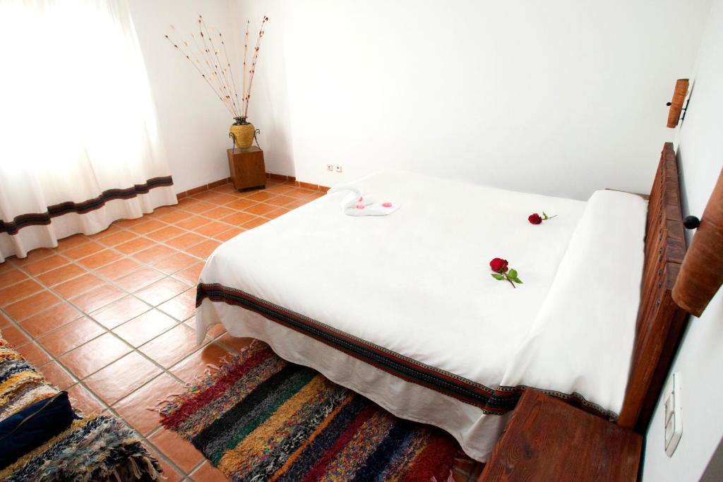 Cama o camas de una habitación en Hostal Mulhacen