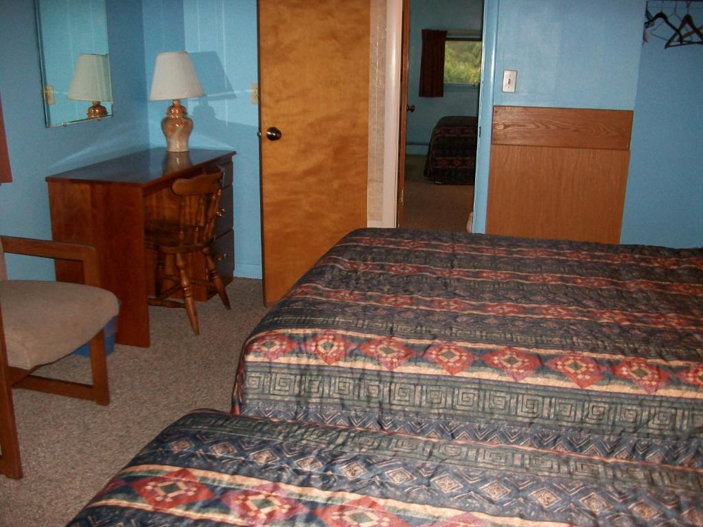Postel nebo postele na pokoji v ubytování Mohican Motel