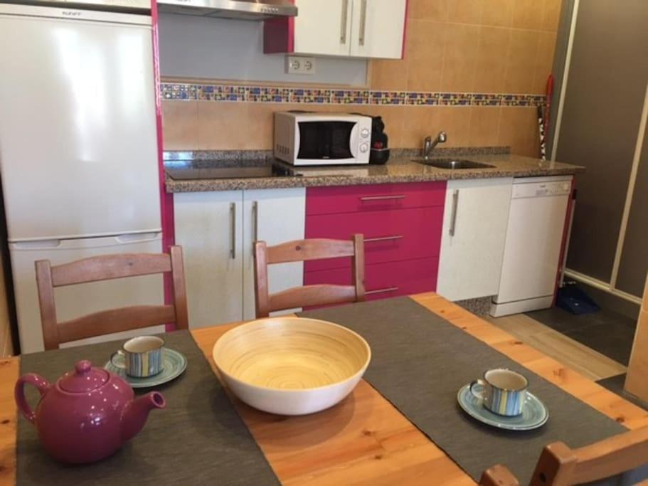 a kitchen with a table with a bowl on top of it at Casita Estela in Frigiliana