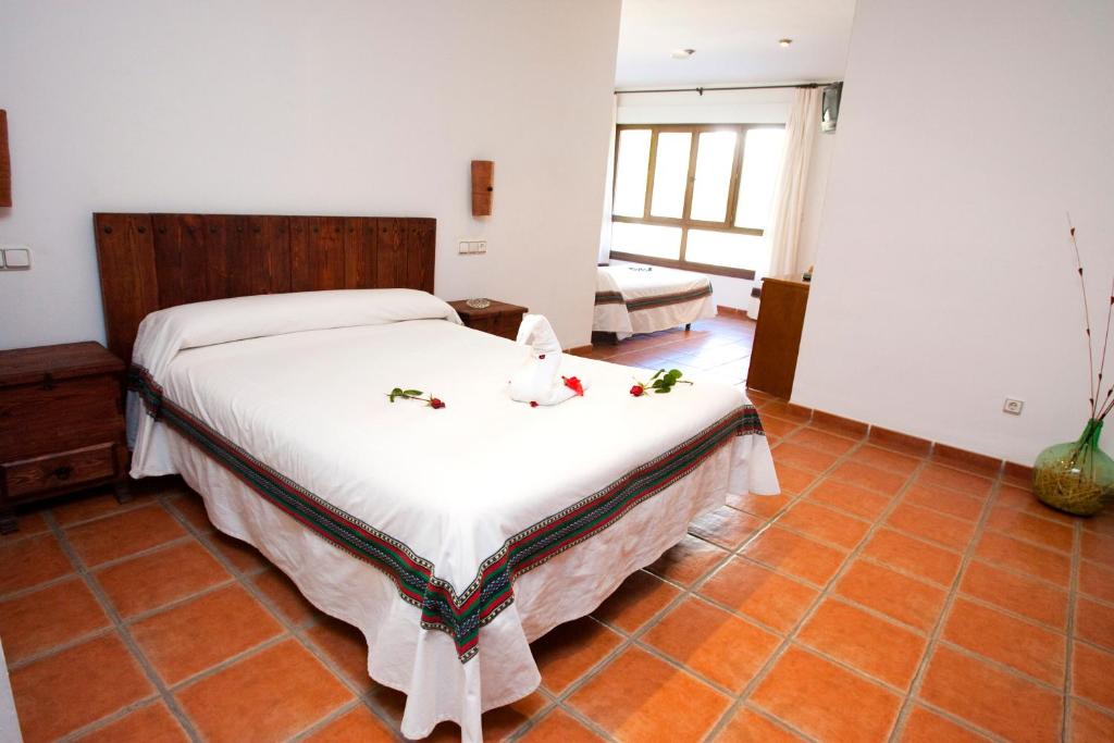 Cama o camas de una habitación en Hostal Mulhacen