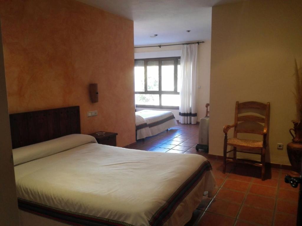 Cama o camas de una habitación en Hostal Mulhacen