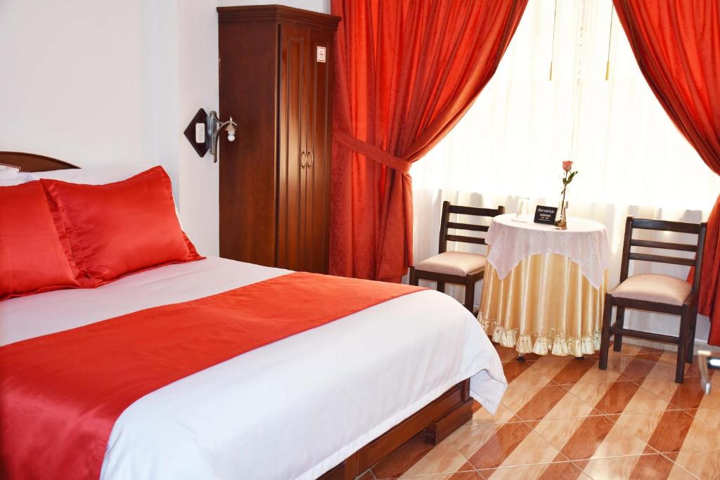 Postel nebo postele na pokoji v ubytování Hotel Plaza Victoria