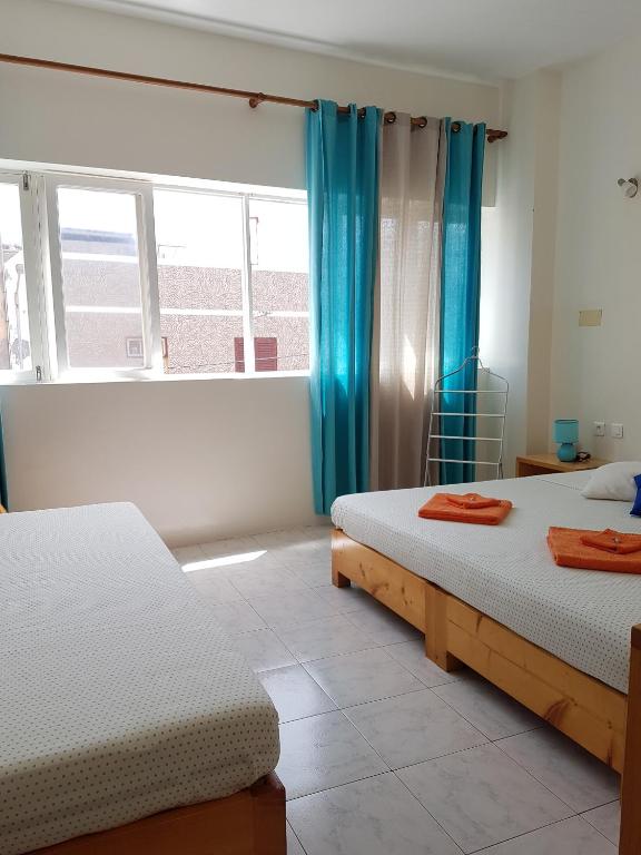 Postel nebo postele na pokoji v ubytování Casa D'Mar