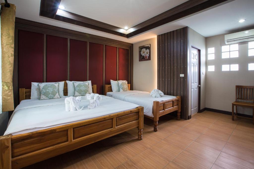 Ένα ή περισσότερα κρεβάτια σε δωμάτιο στο Baanchernchiangmai Hotel