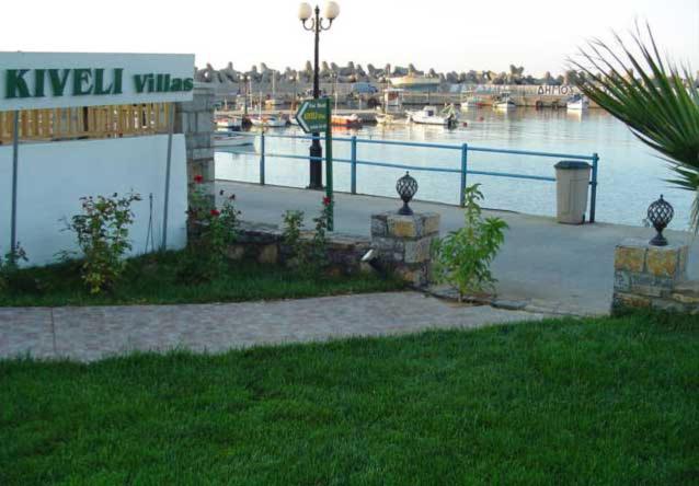 a marina with a sign that reads klysil villages at Kiveli in Milatos