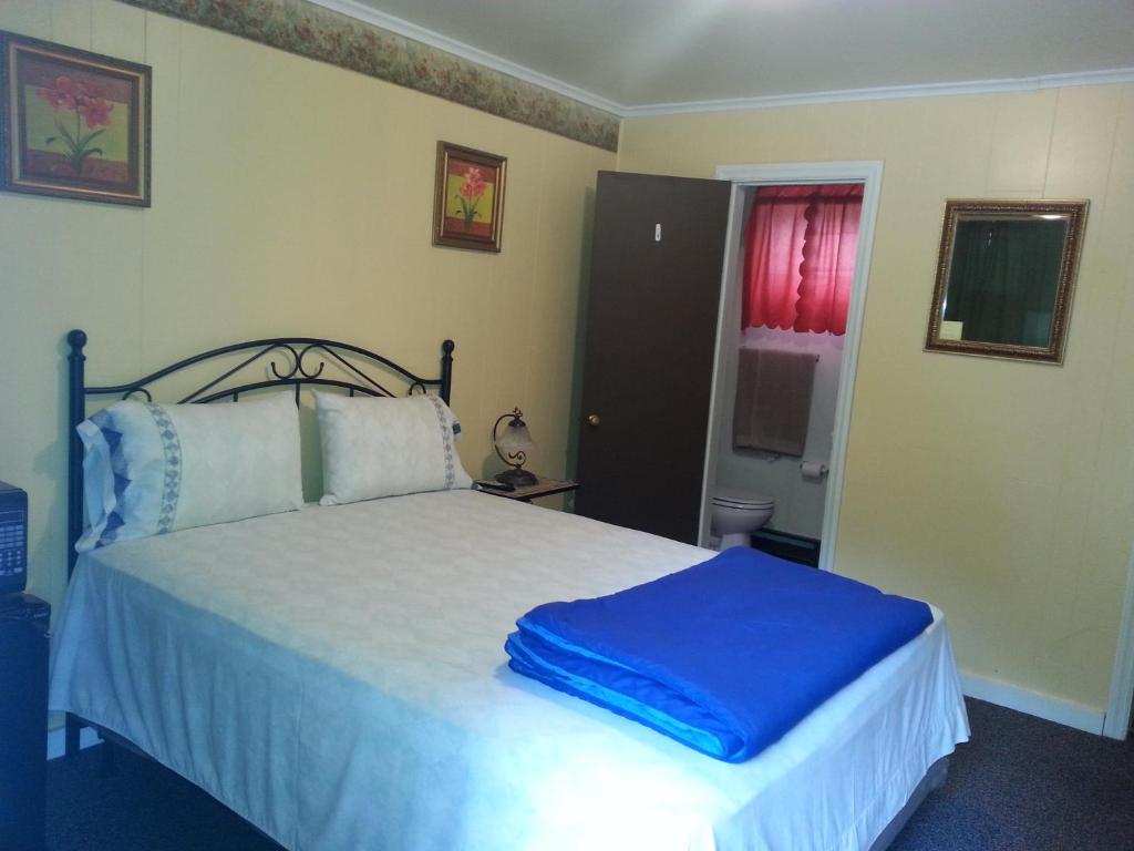 Postel nebo postele na pokoji v ubytování Paradise Resort Saratoga
