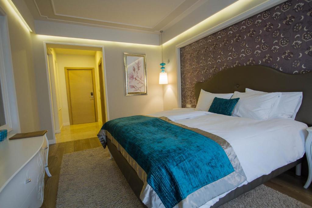 Postel nebo postele na pokoji v ubytování Hotel Dragului