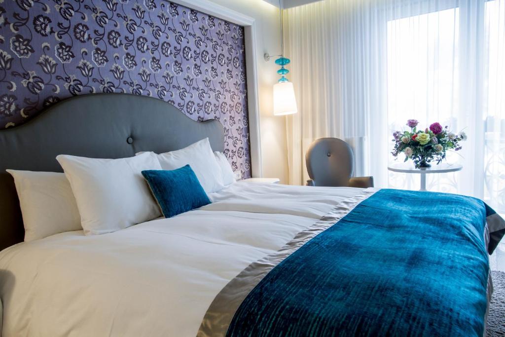 Postel nebo postele na pokoji v ubytování Hotel Dragului