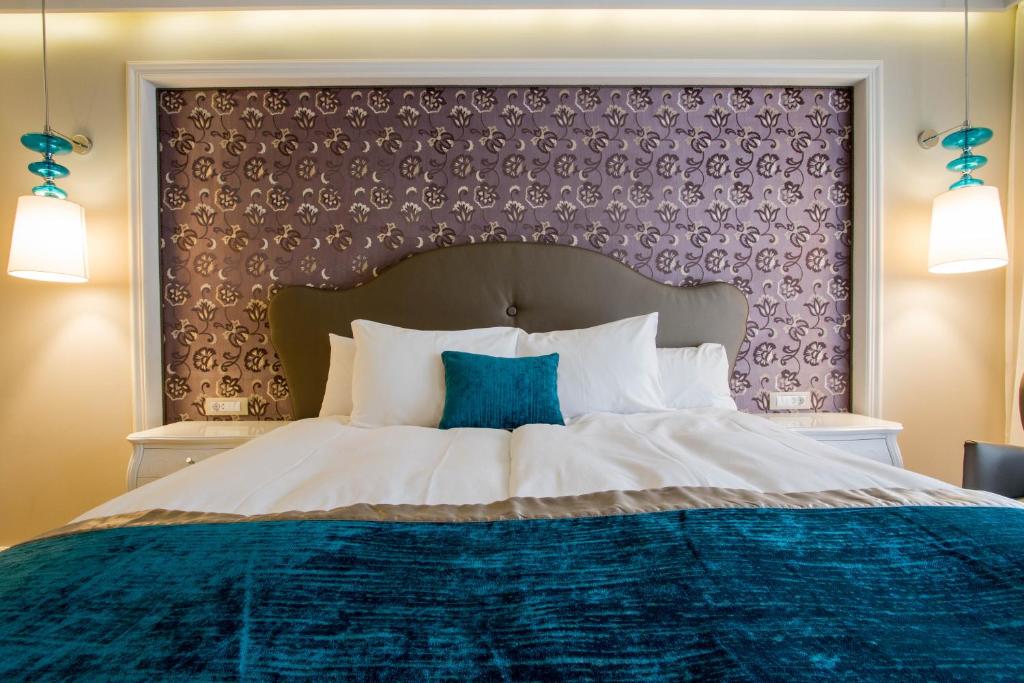 Postel nebo postele na pokoji v ubytování Hotel Dragului