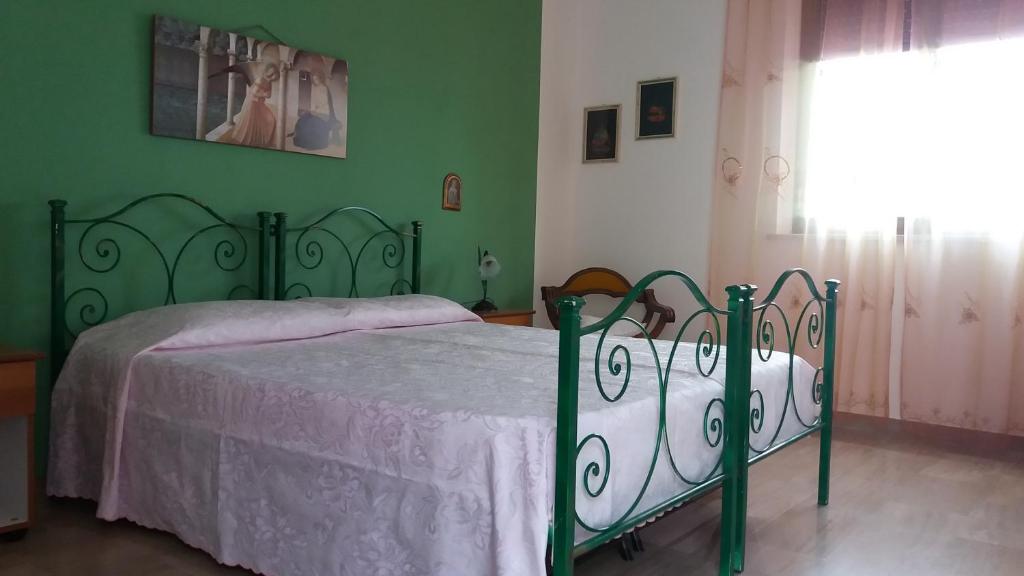 Postel nebo postele na pokoji v ubytování Bed and Breakfast Arcobaleno
