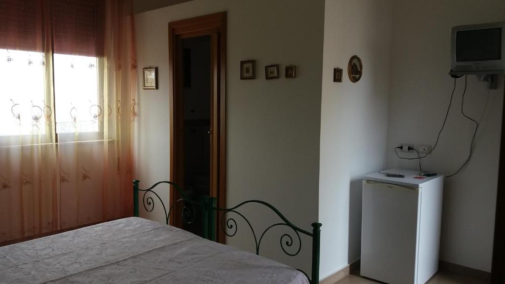 Postel nebo postele na pokoji v ubytování Bed and Breakfast Arcobaleno