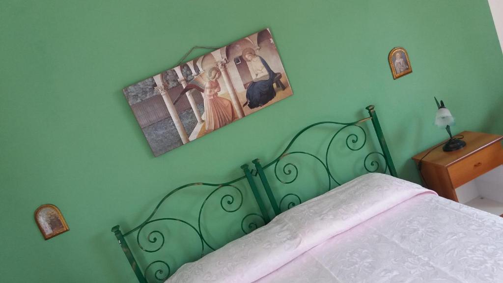 Postel nebo postele na pokoji v ubytování Bed and Breakfast Arcobaleno