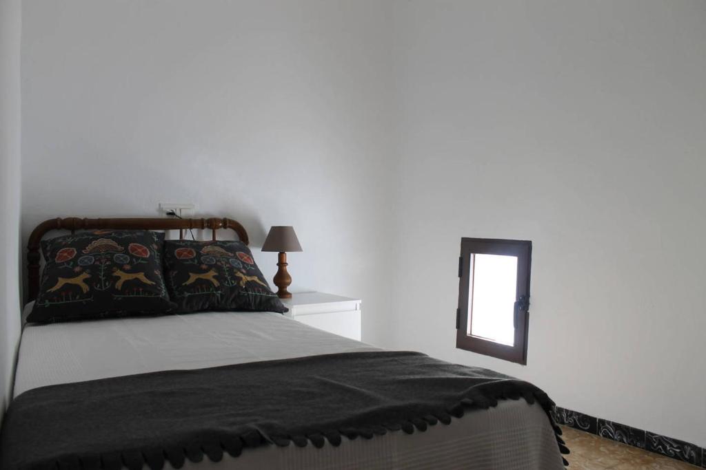 Postel nebo postele na pokoji v ubytování La casita de la ciudad