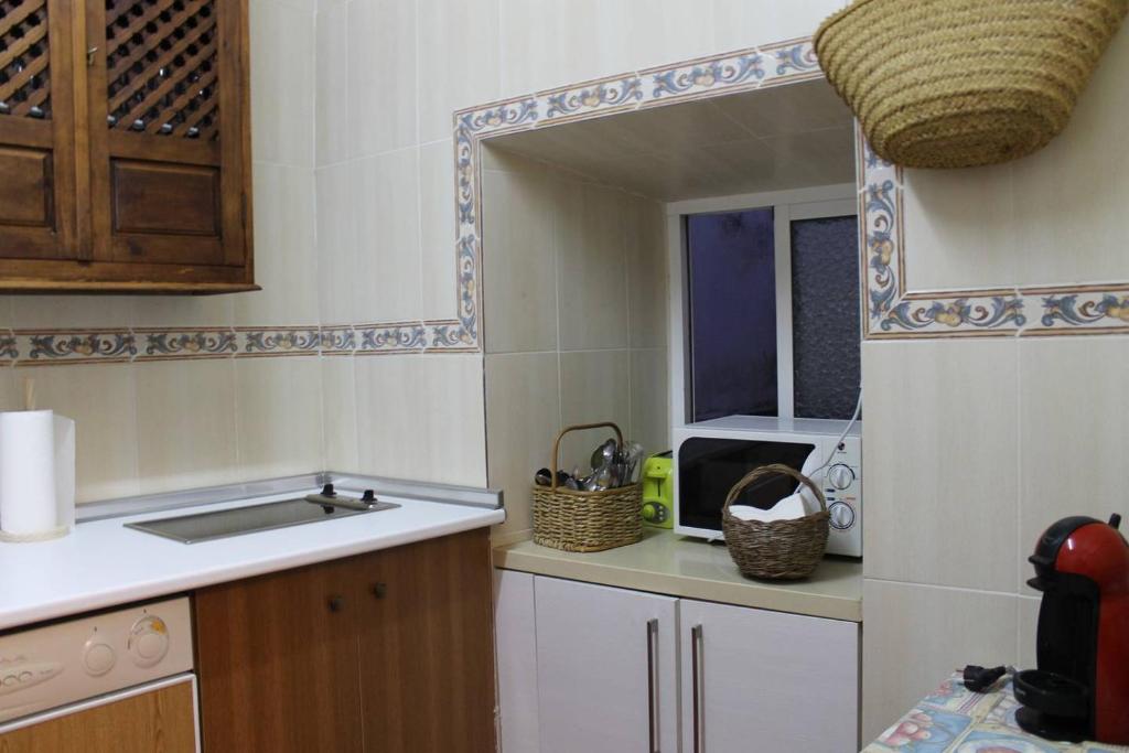 Kuchyň nebo kuchyňský kout v ubytování La casita de la ciudad