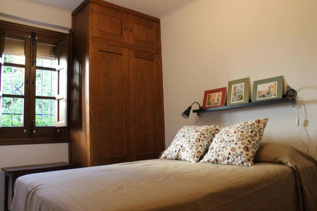 Postel nebo postele na pokoji v ubytování La casita de la ciudad