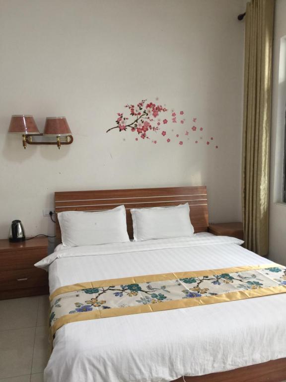 Postel nebo postele na pokoji v ubytování Huashan Gehui Hotel