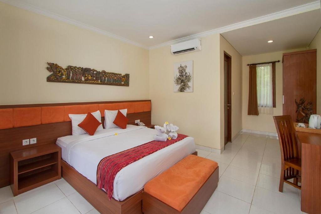 Postel nebo postele na pokoji v ubytování Pondok Massas Ubud