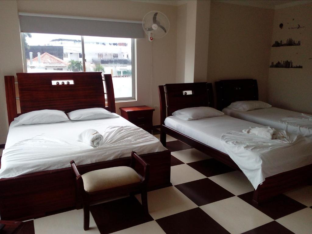 Postel nebo postele na pokoji v ubytování Hotel Prado Country