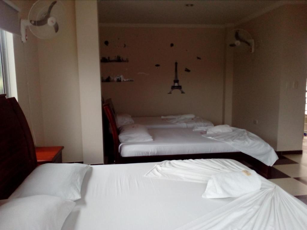 Postel nebo postele na pokoji v ubytování Hotel Prado Country
