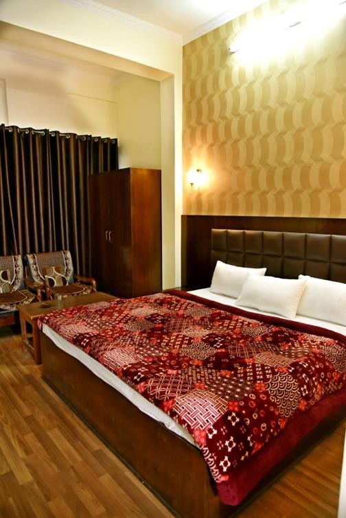 Postel nebo postele na pokoji v ubytování Hotel Ram