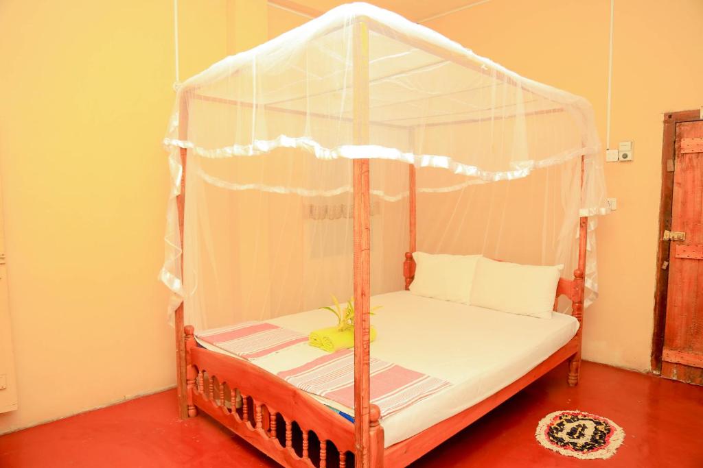 Postel nebo postele na pokoji v ubytování Natural Cabanas