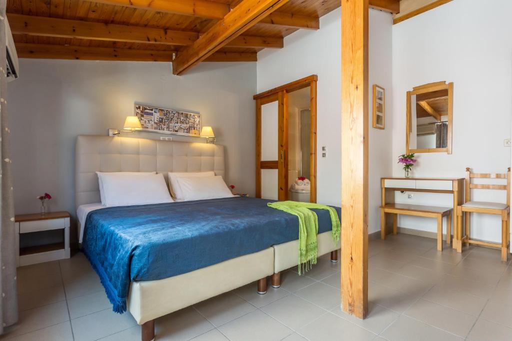 Postel nebo postele na pokoji v ubytování Hotel Akti
