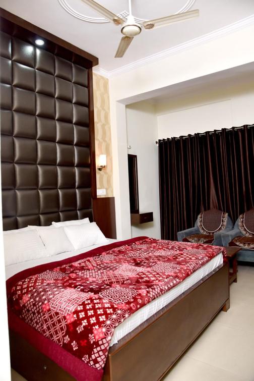 Postel nebo postele na pokoji v ubytování Hotel Ram