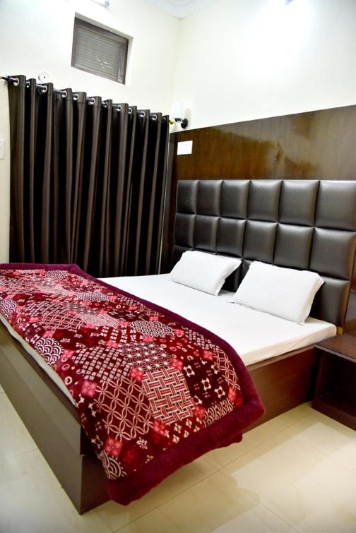 Postel nebo postele na pokoji v ubytování Hotel Ram