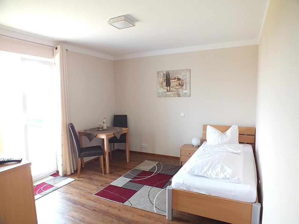 Postel nebo postele na pokoji v ubytování Hotel Alex