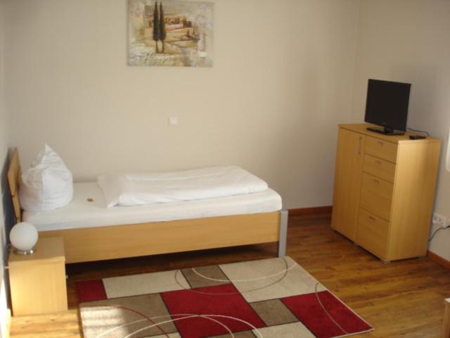 Postel nebo postele na pokoji v ubytování Hotel Alex