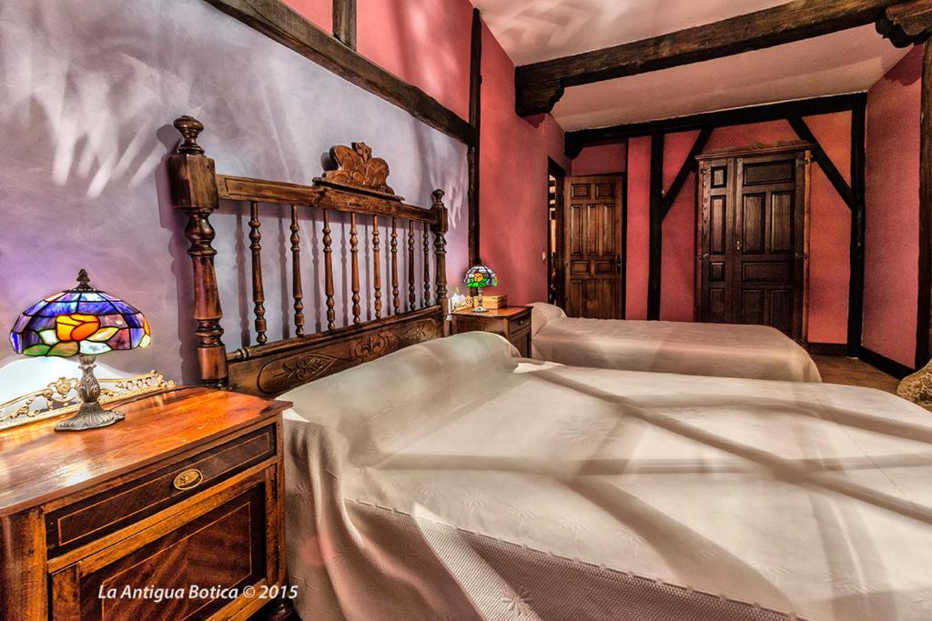Cama o camas de una habitación en La Antigua Botica
