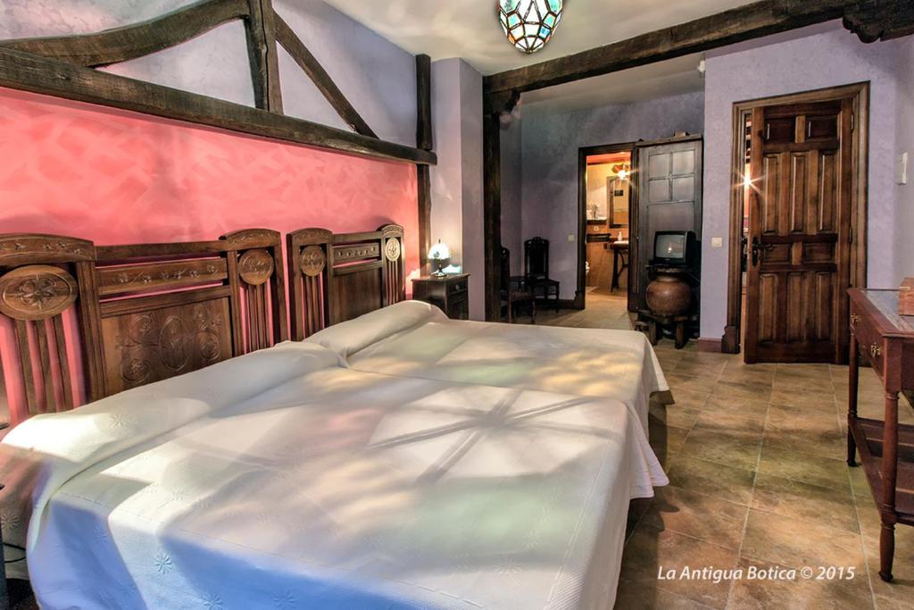Cama o camas de una habitación en La Antigua Botica