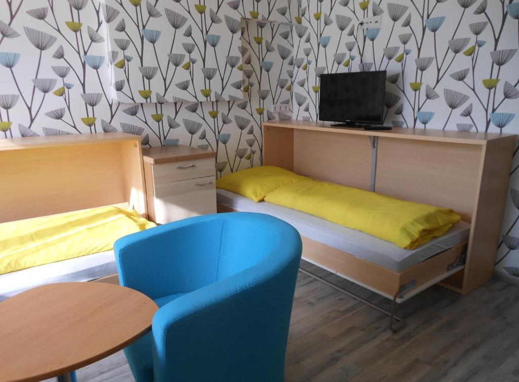Postel nebo postele na pokoji v ubytování Pension Hainbuch