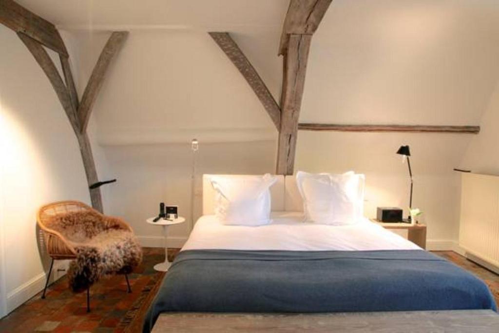 Postel nebo postele na pokoji v ubytování Hotel Julien