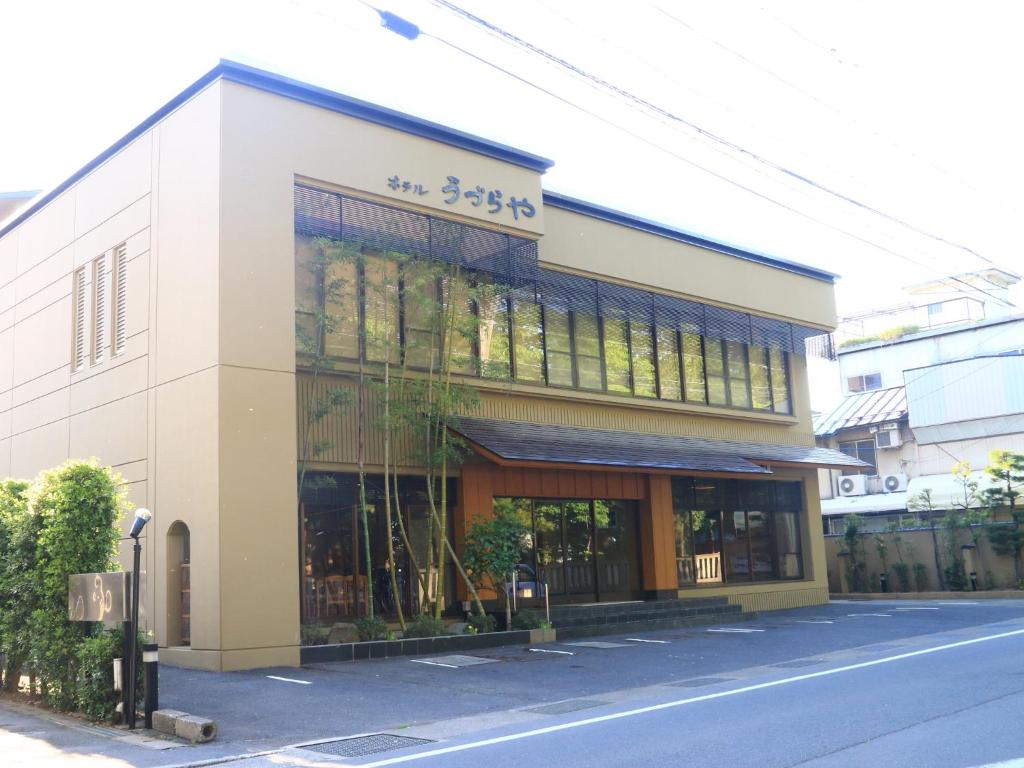 a building on the side of a street at Hotel Uzuraya in Chikuma