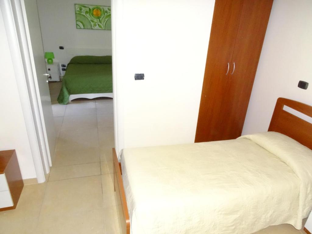 Łóżko lub łóżka w pokoju w obiekcie B&B Soleluna