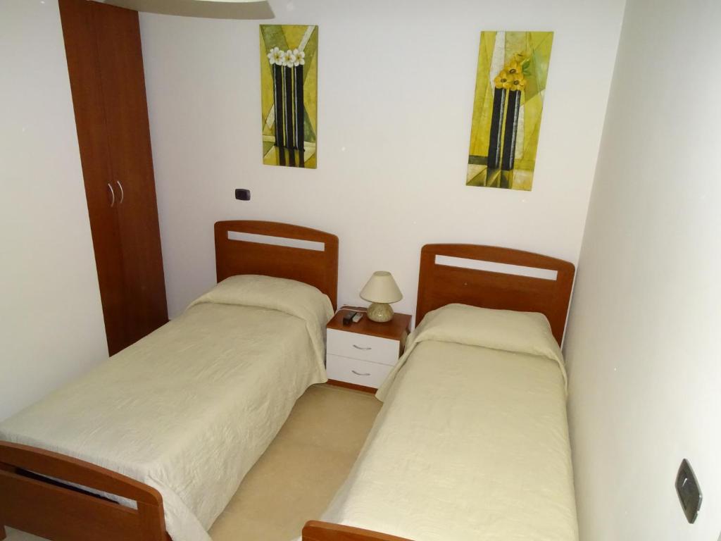 Łóżko lub łóżka w pokoju w obiekcie B&B Soleluna