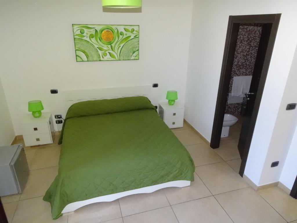 Łóżko lub łóżka w pokoju w obiekcie B&B Soleluna