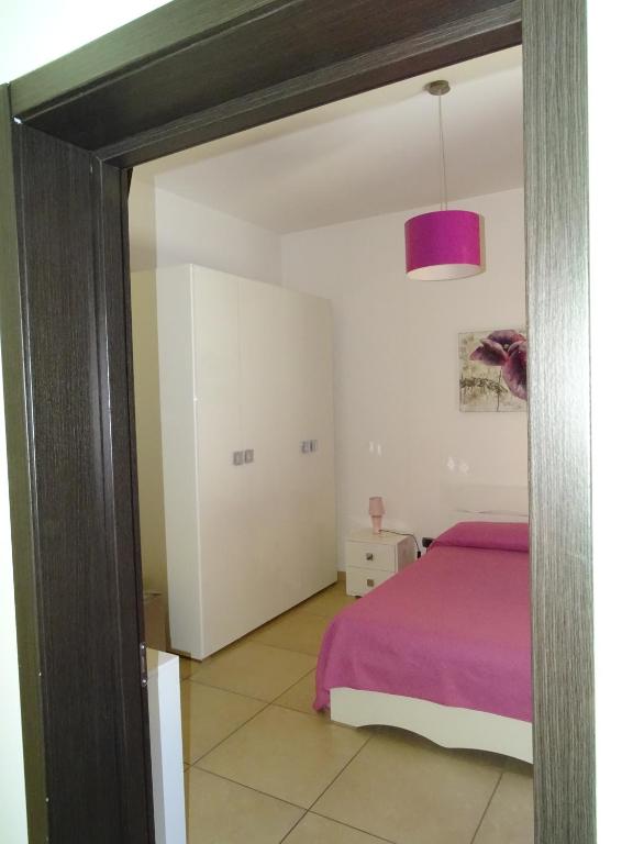 Łóżko lub łóżka w pokoju w obiekcie B&B Soleluna