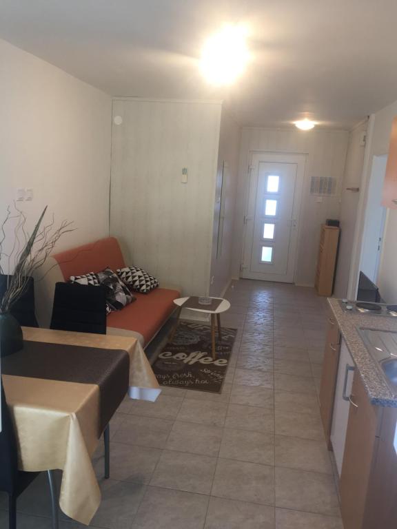 a living room with a couch and a table at Apartment Buic in Pula