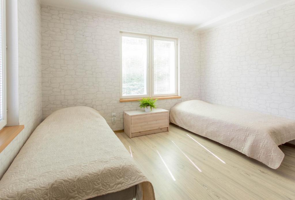 Postel nebo postele na pokoji v ubytování Pärnu Villa Harmony